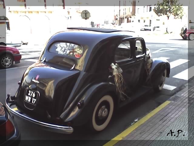 black vintage car parked on the side of the road