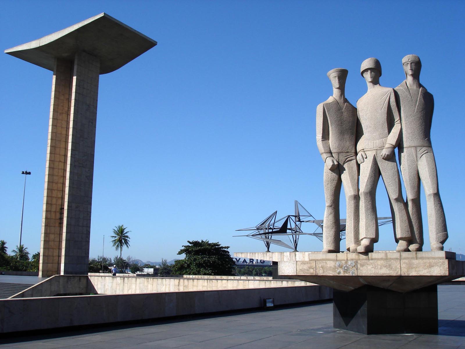 there are statues sitting in front of the building