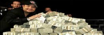 two guys surrounded by a pile of cash