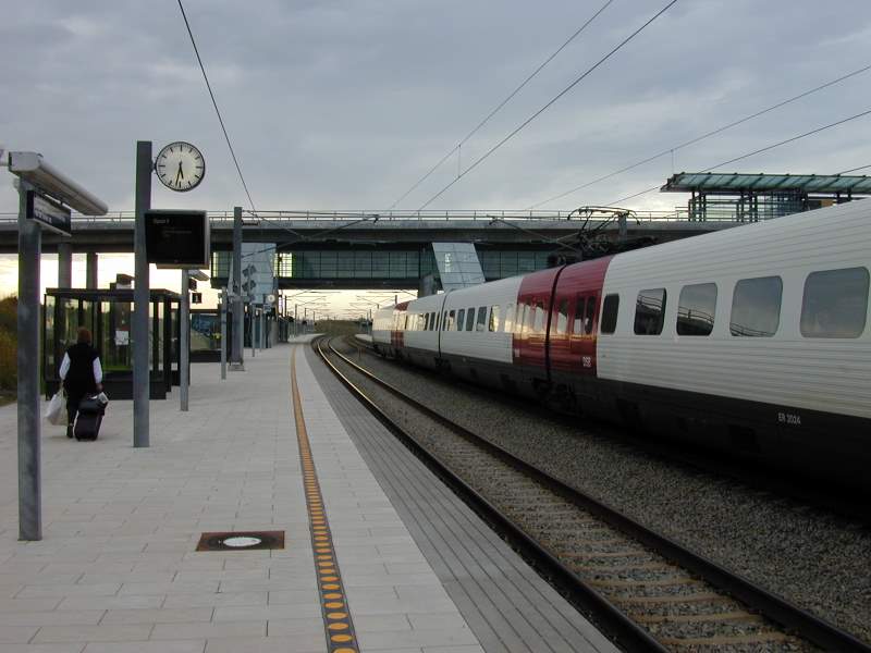 a commuter train traveling through a train station