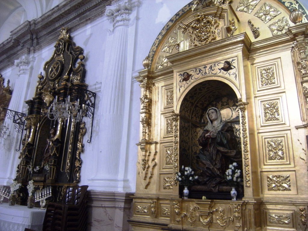 the statue inside of a church has ornate decorations