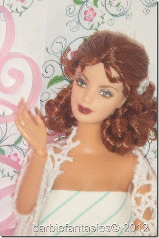 a doll with a red hair, long id and white dress