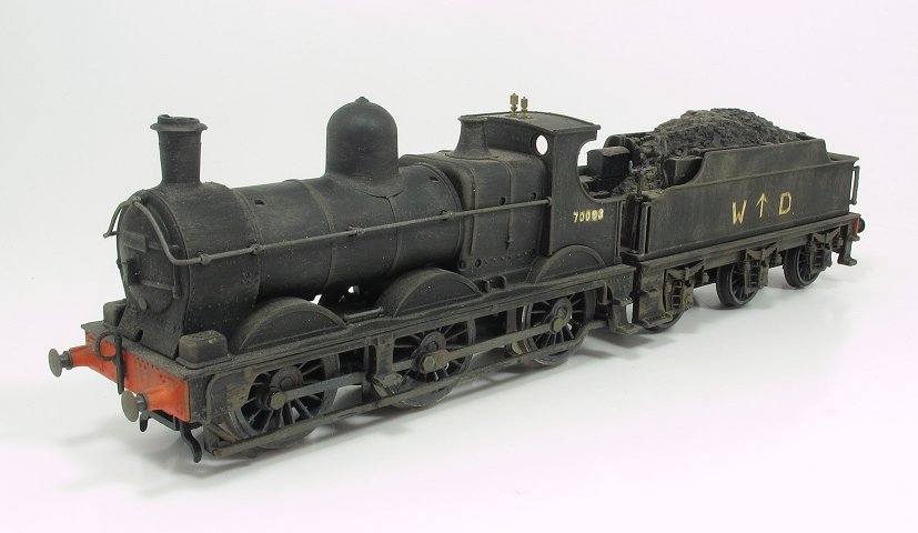 a black model train car on a white table
