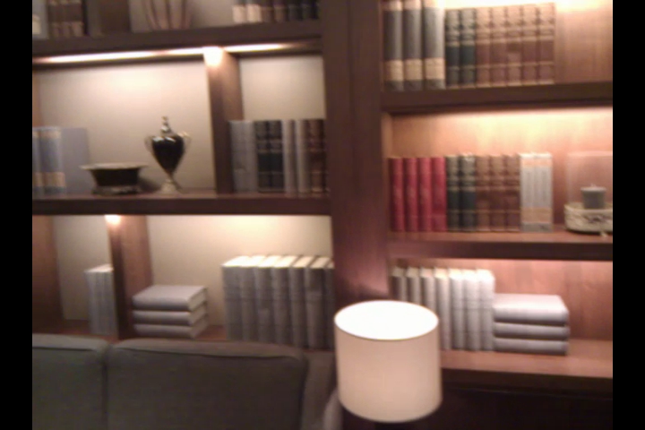 a lamp and some books in a room