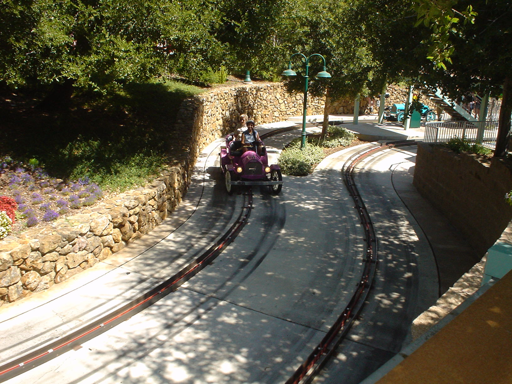 a car is moving down the train tracks