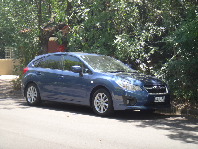 a subarunt car parked on a side of the road