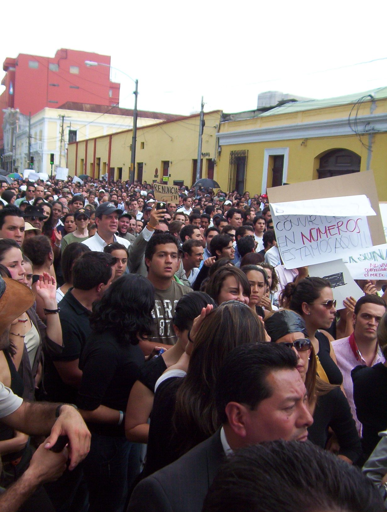 a large group of people standing on a street