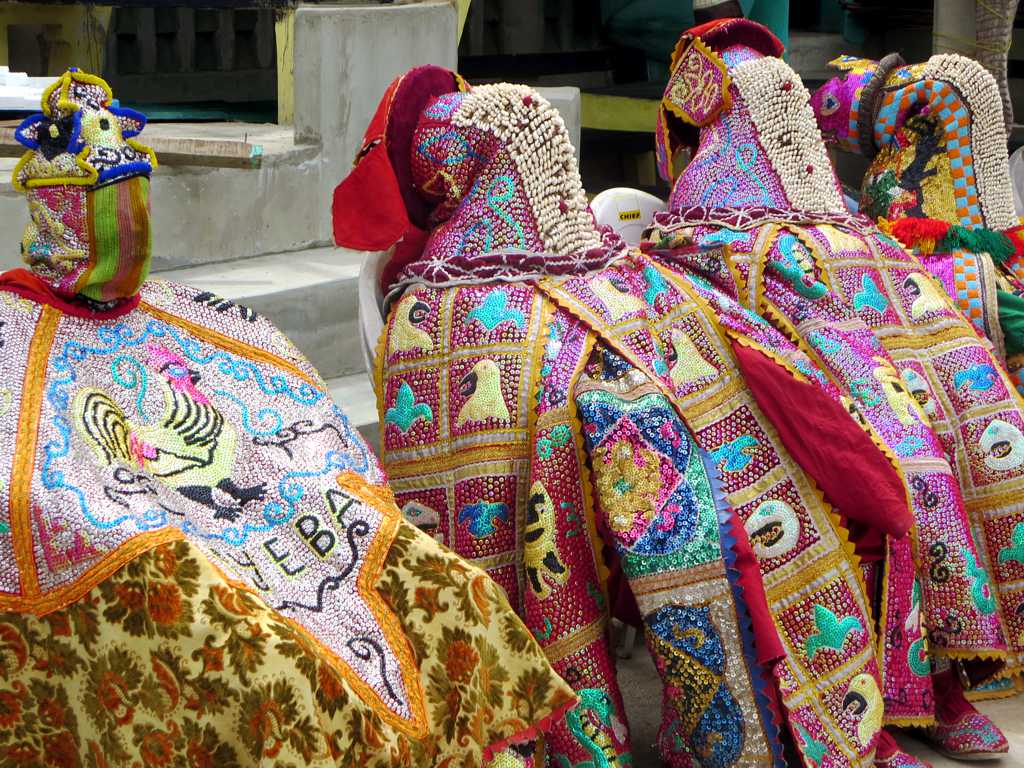 a number of cloth covered items on display