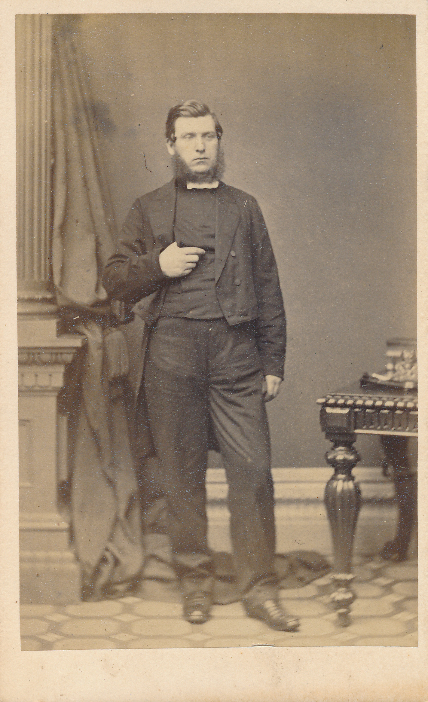 a man is standing in front of a table