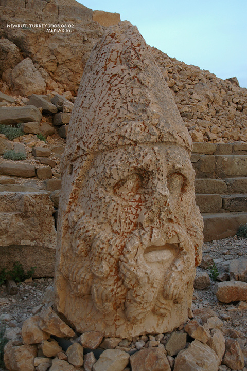 an old statue that has been made into a head