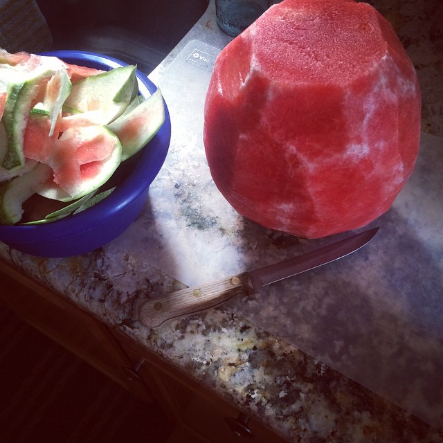 a bowl full of cut up watermelon sitting on top of a counter