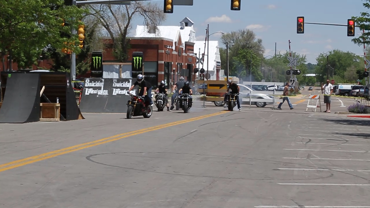 a motorcycle club has passed through the intersection
