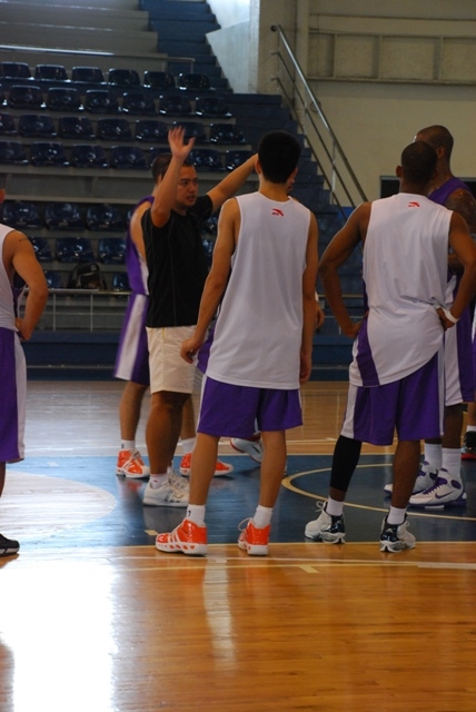 young athletes stand for a group po during a basketball game