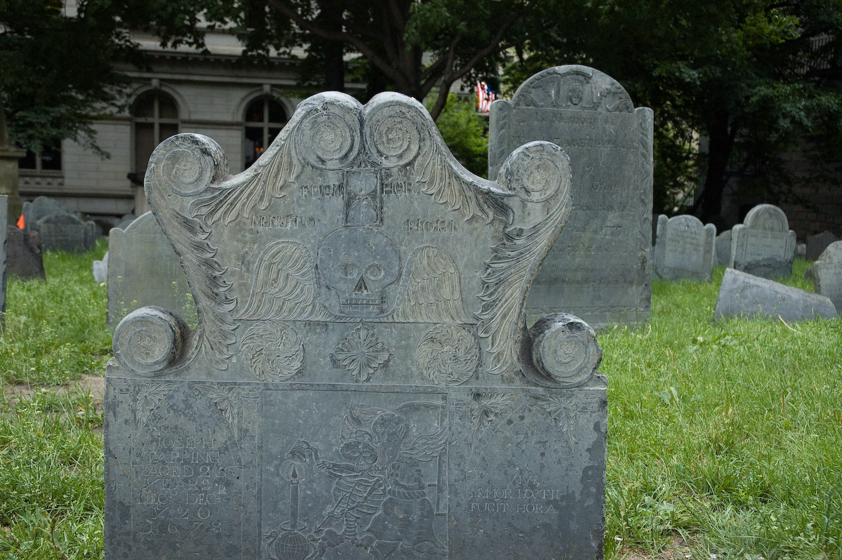 a cemetery with many headstones, like this one in a cemetery