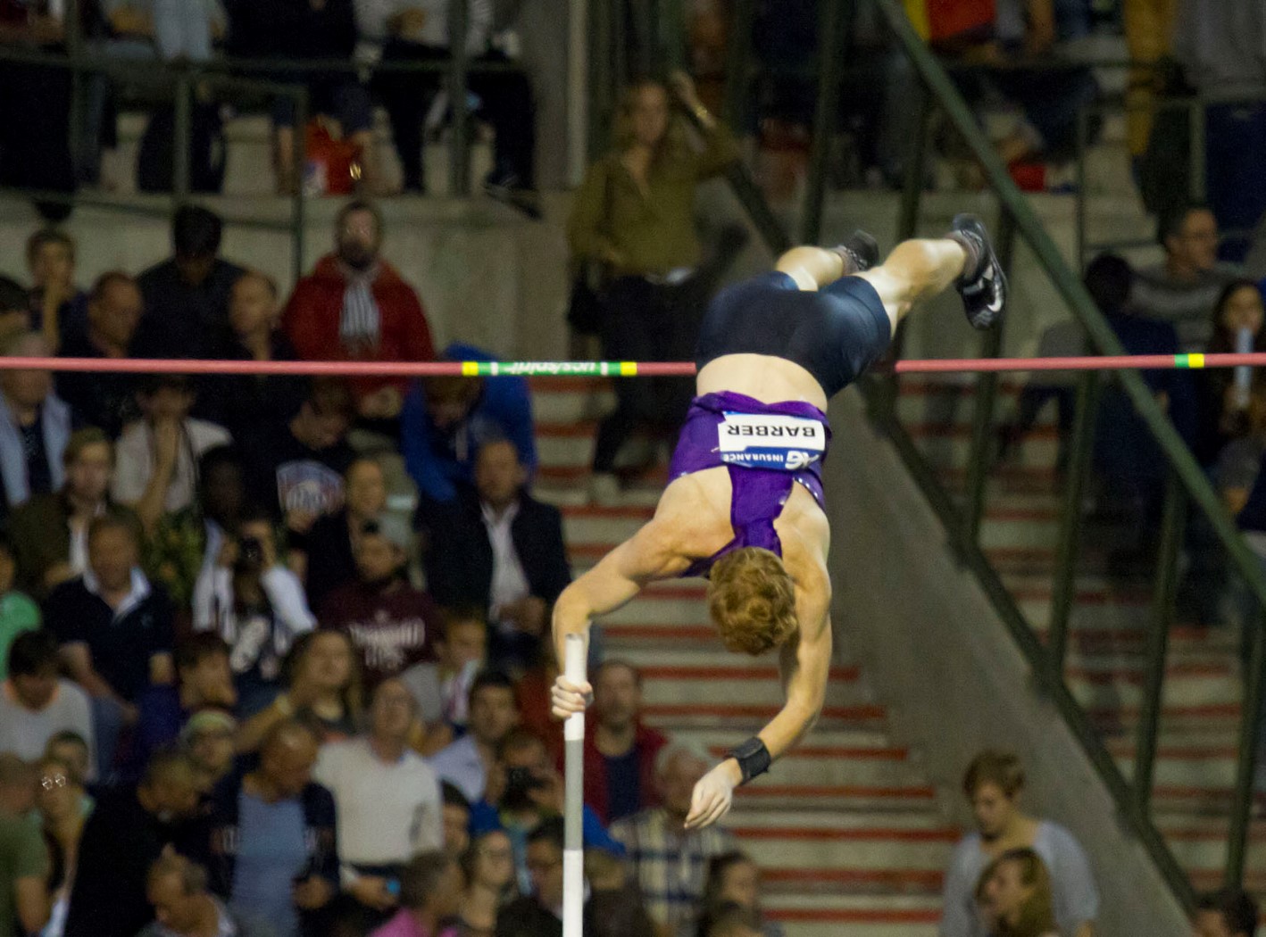 a young man high in the air while competing