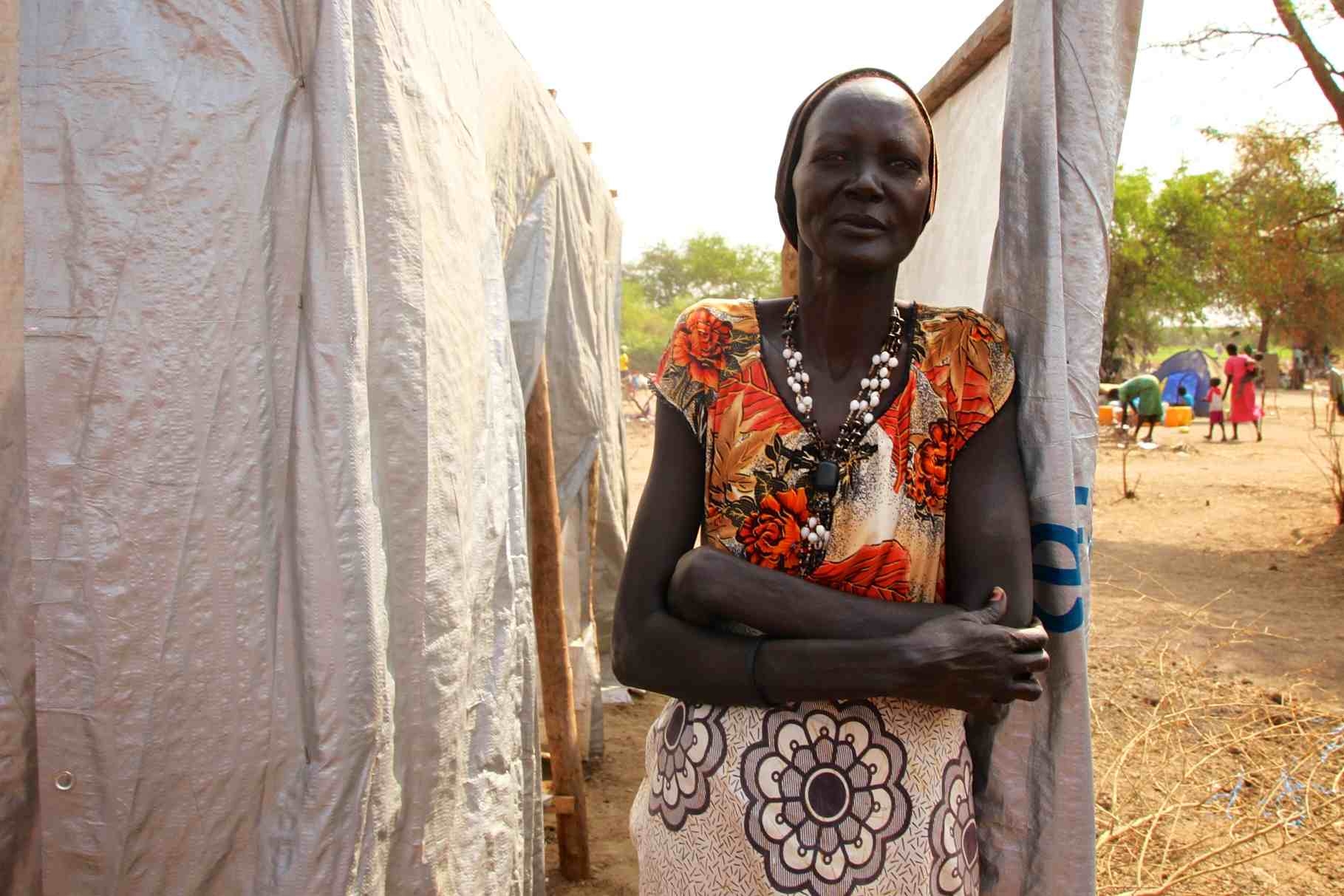 a woman in native dress posing for the camera