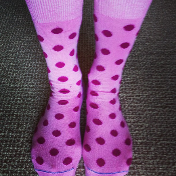 a pink dotted socked with polka dots
