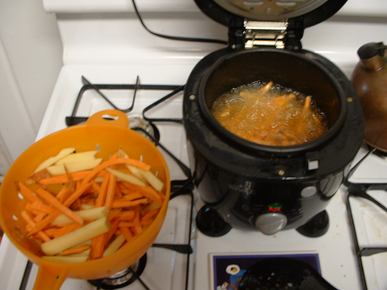 a slow cooker with a bowl and a container of food