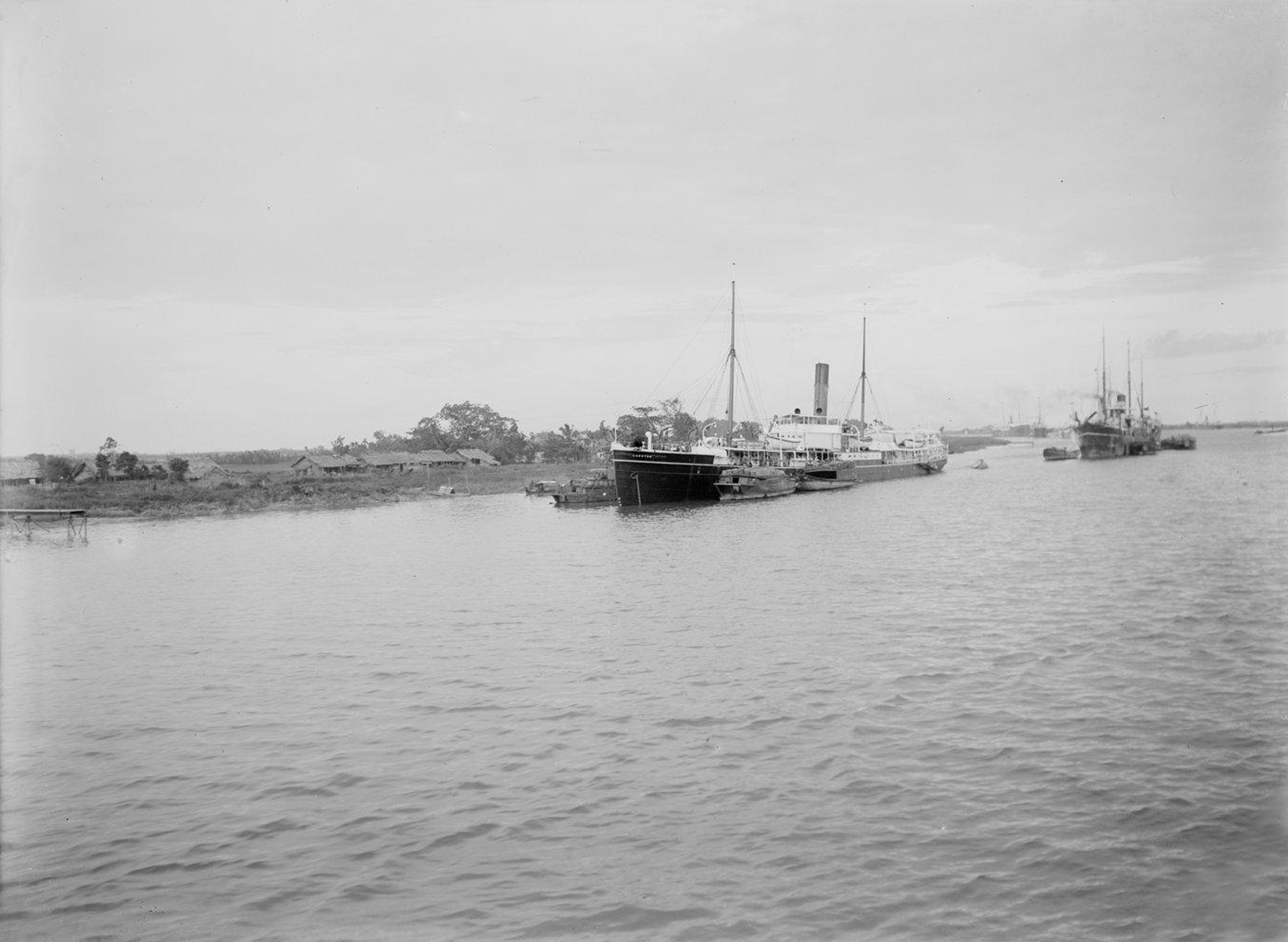 a river with several boats parked in it