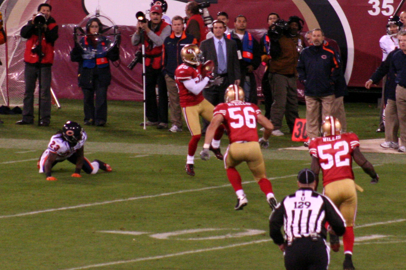 players are running while standing on the field during a game