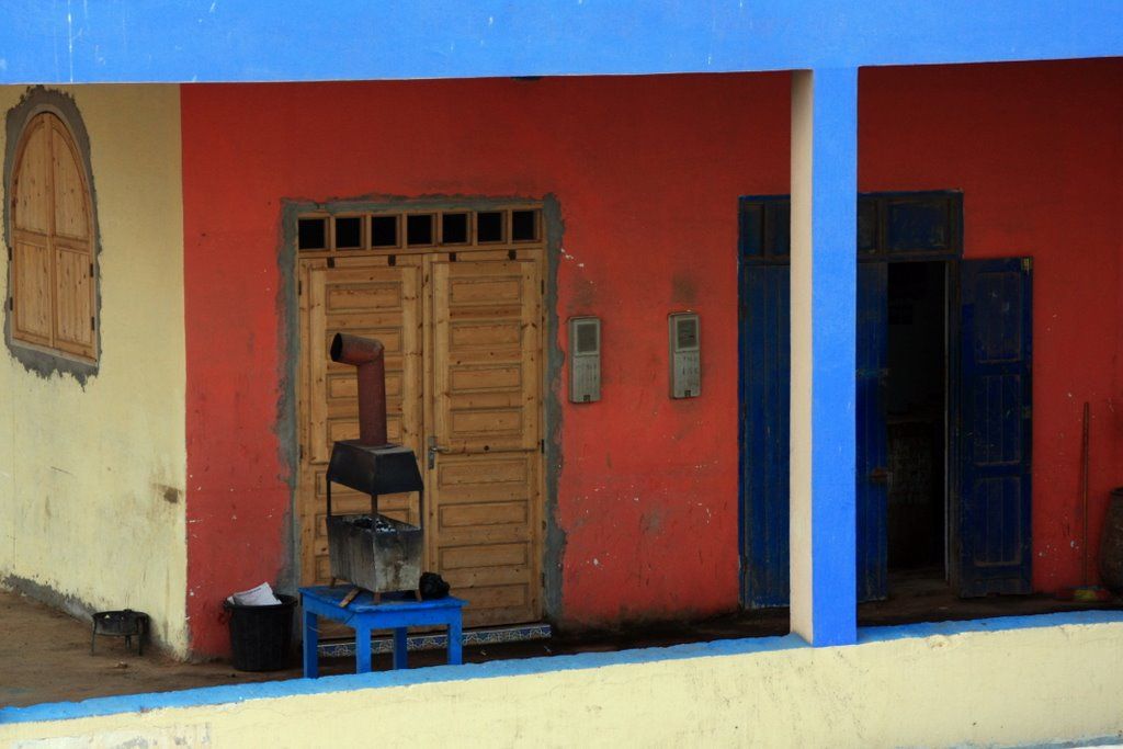 two tall brown doors are next to each other