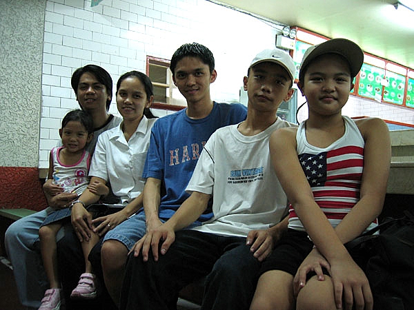 a group of young people in sports shirts and hats