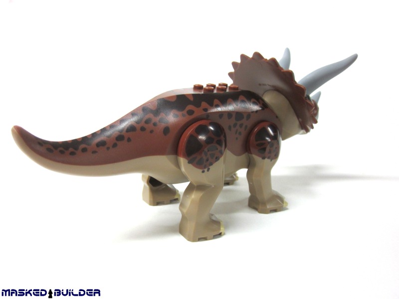 a toy toy of a dinosaur with long horns and claws