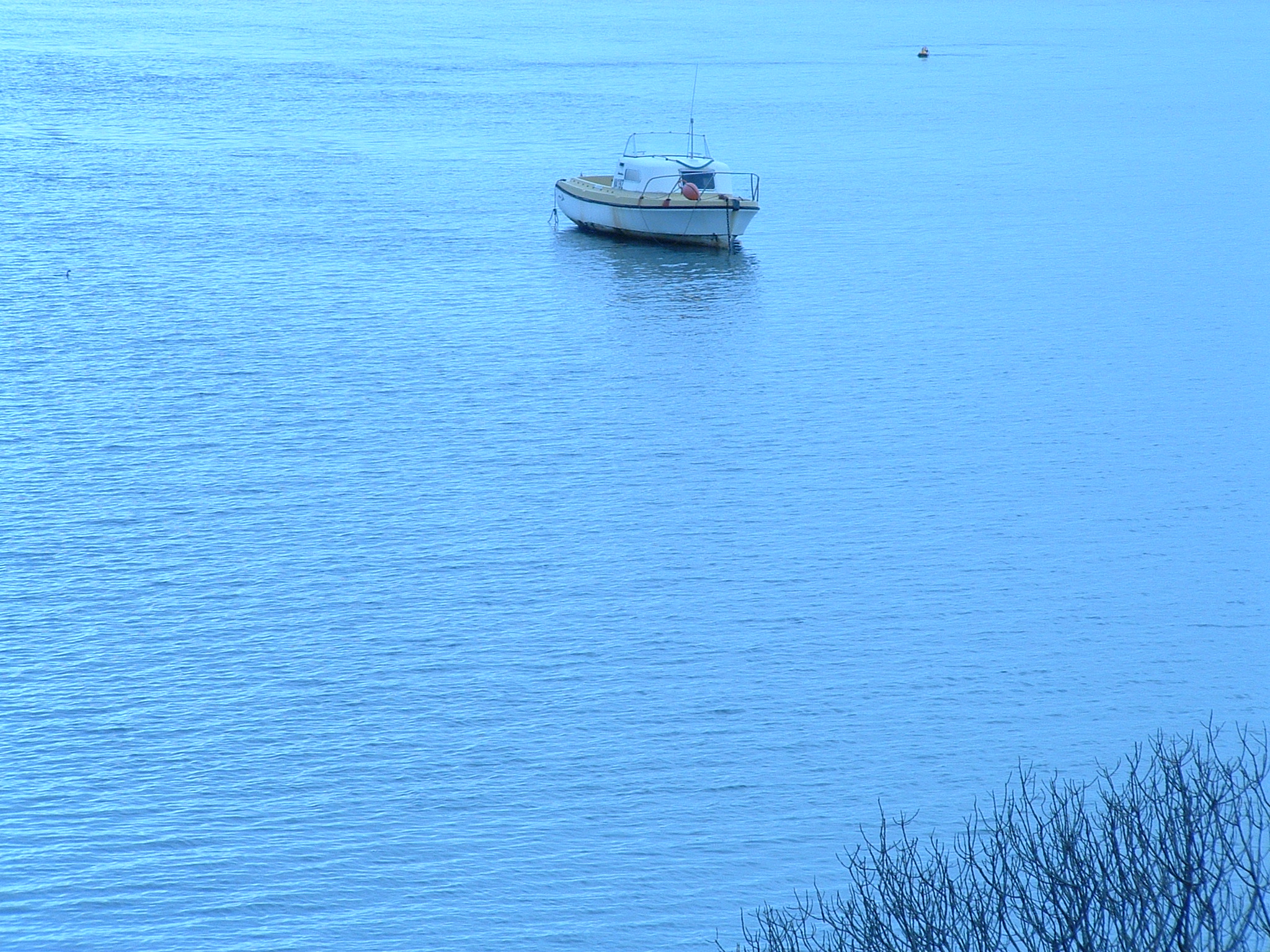 there is a small boat out in the water