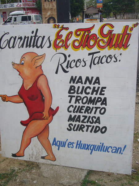 a large sign with a pig on the outside