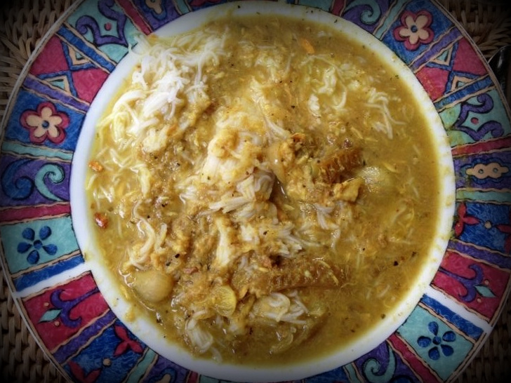 a bowl of cabbage and bread soup is pictured here