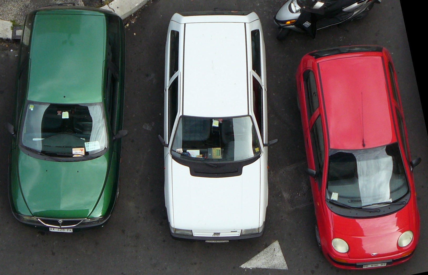 three cars parked in the parking lot