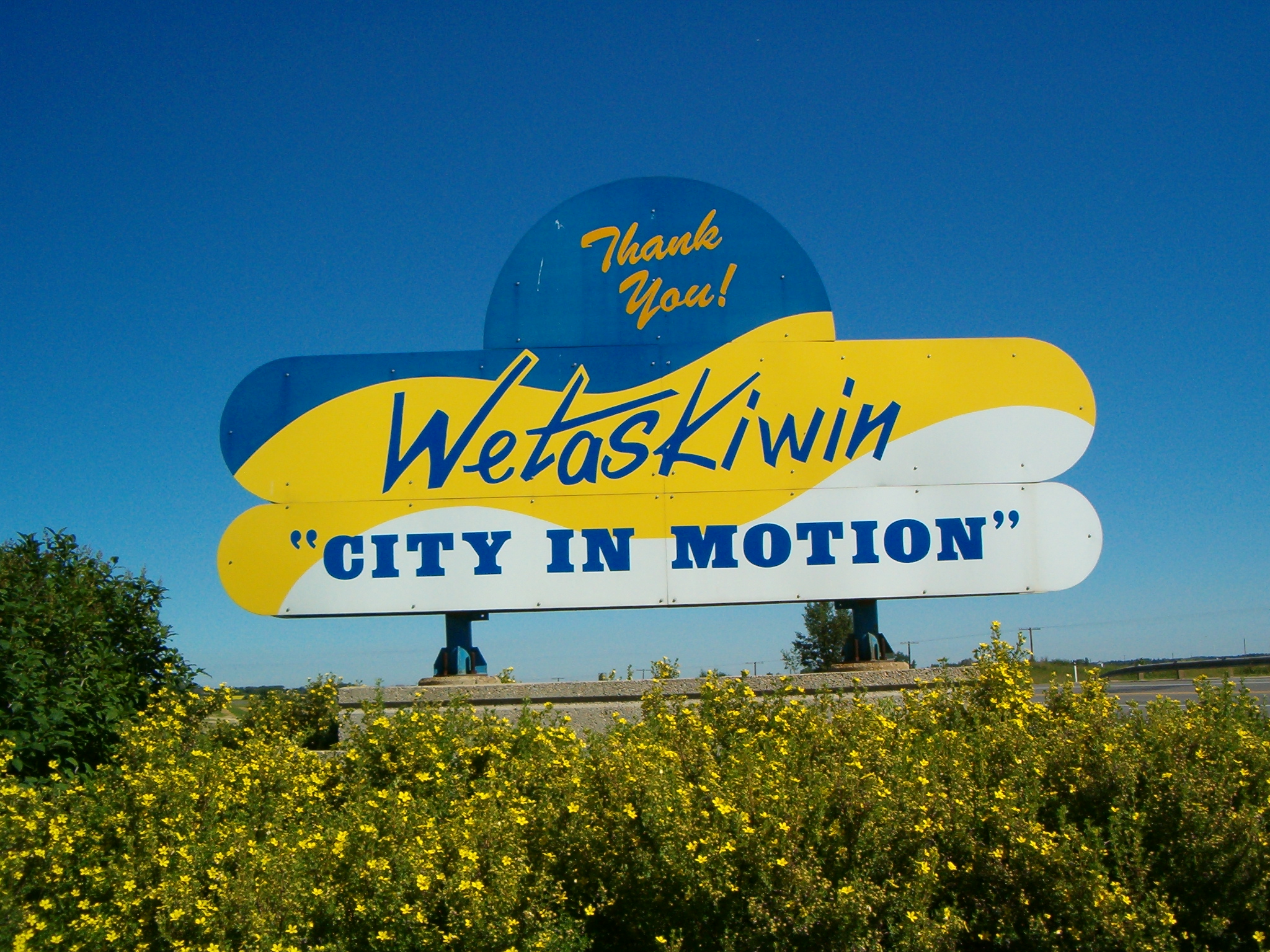 a big sign is advertising the city in motion