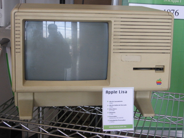 a small apple tv sits next to a smaller one on display