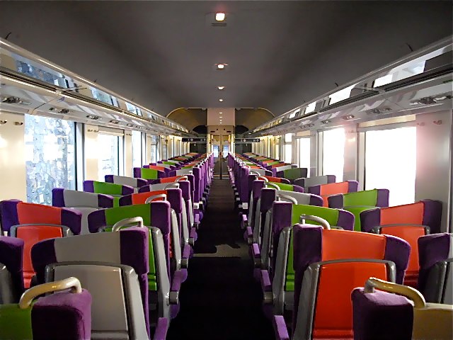 brightly colored seats and windows in a bus