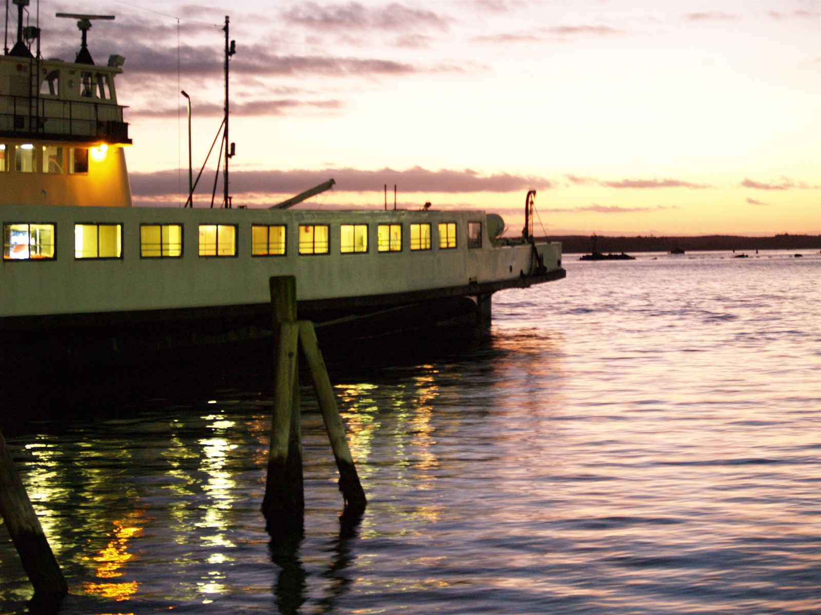 a large boat sitting next to a dock