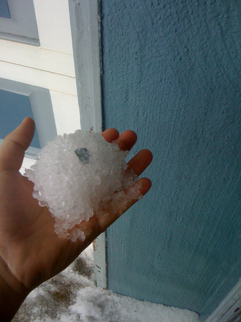 someone holding some very tiny white ice crystals