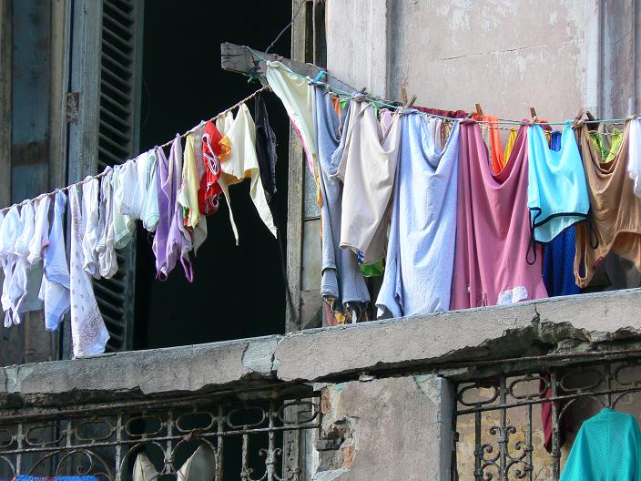 clothes hanging on the line in an old building