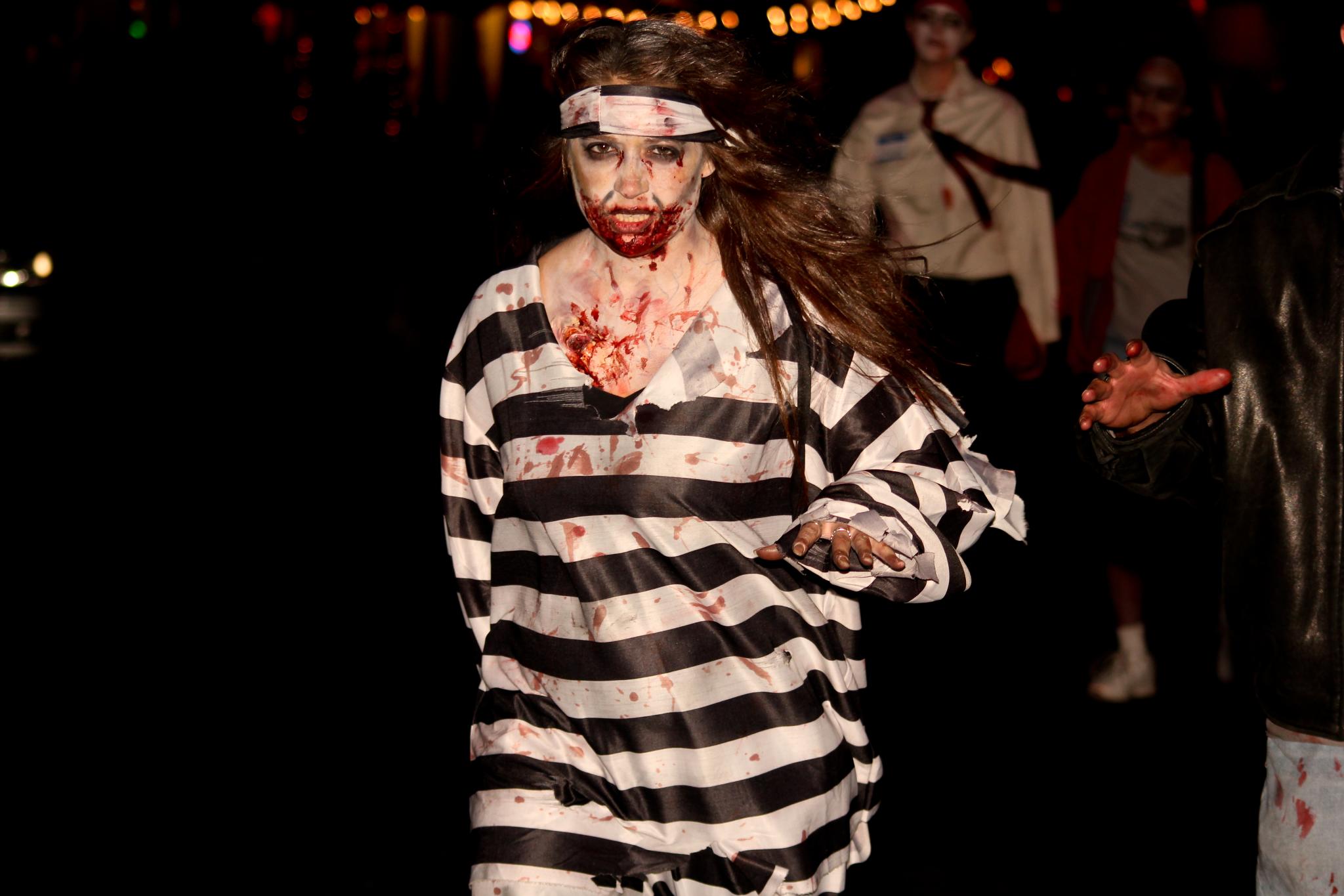 a male and female dressed in costumes with makeup