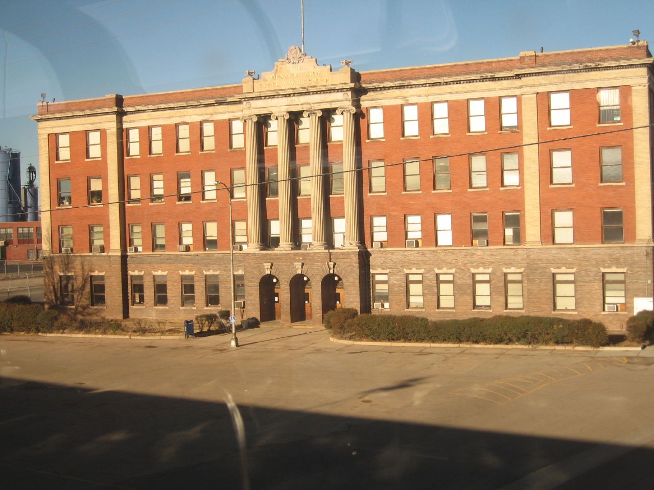 a large building with windows and doors sits empty