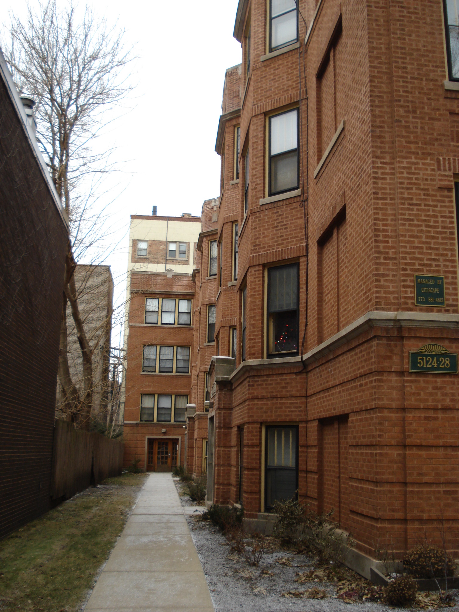 an alley between some tall buildings with windows