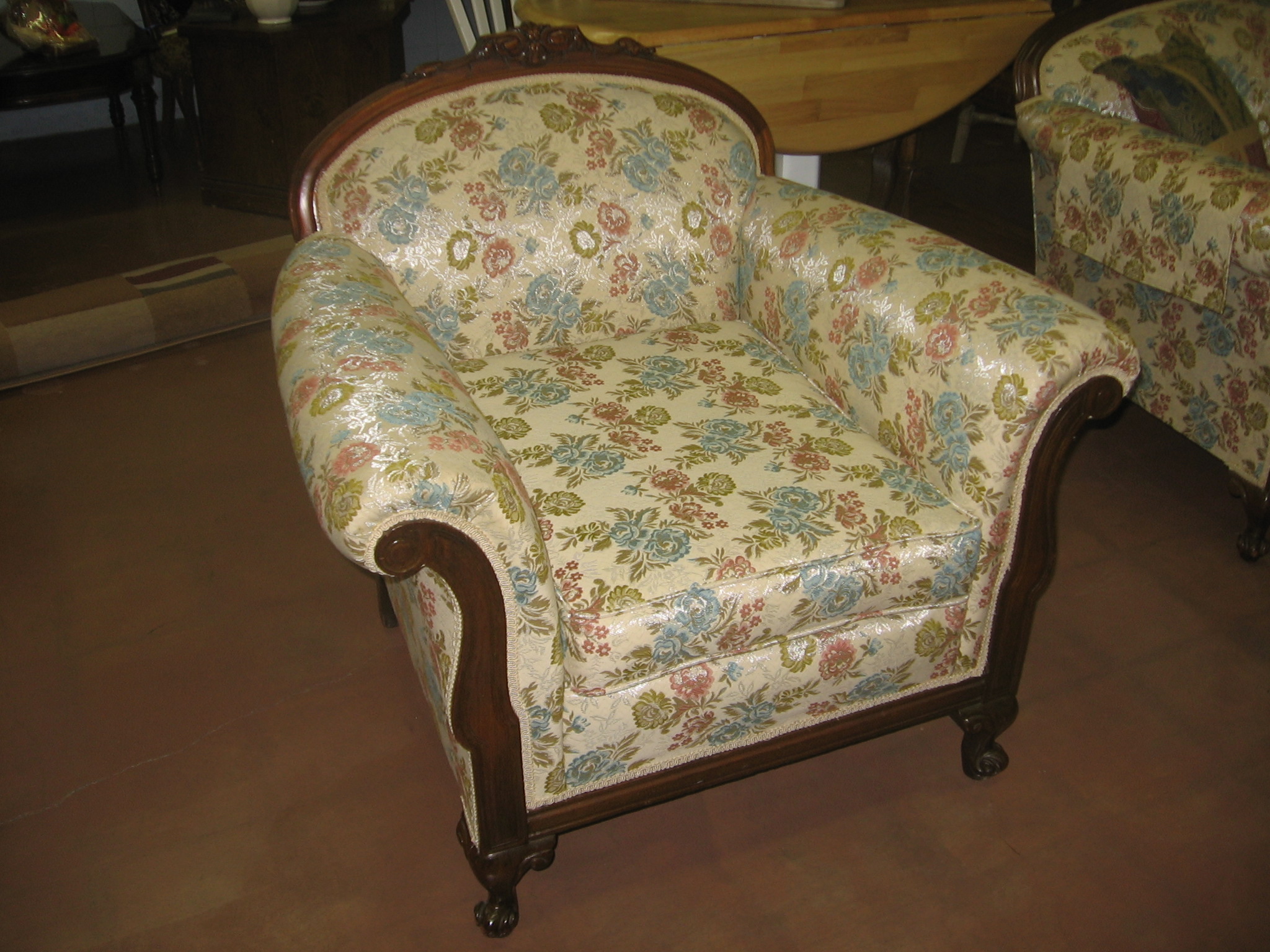 a settee is shown with floral print on it