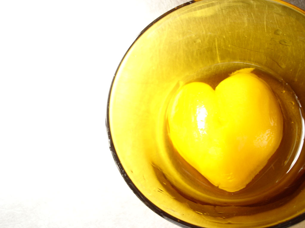there is a yellow heart inside a yellow bowl