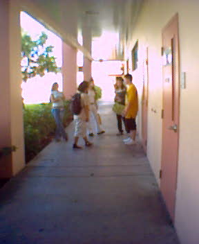 a group of people walking down a corridor