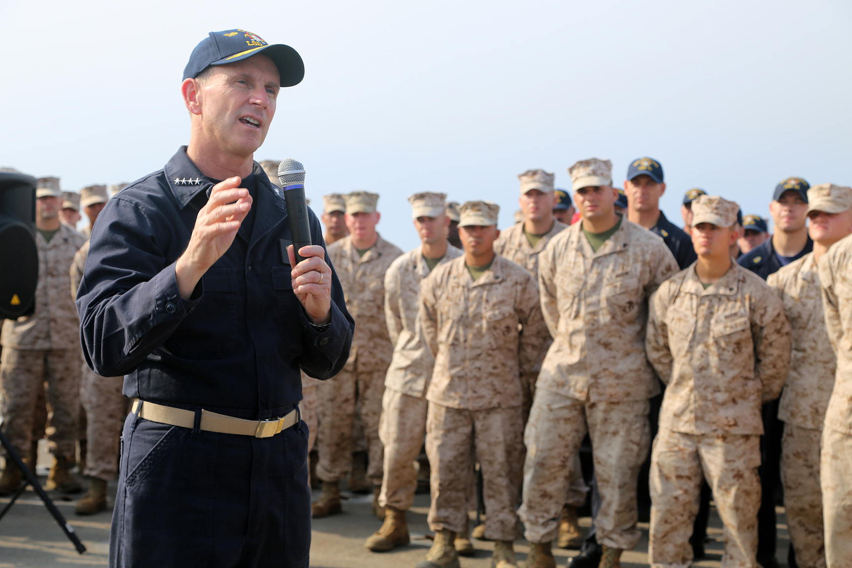 the military men are standing in formation at the military ceremony