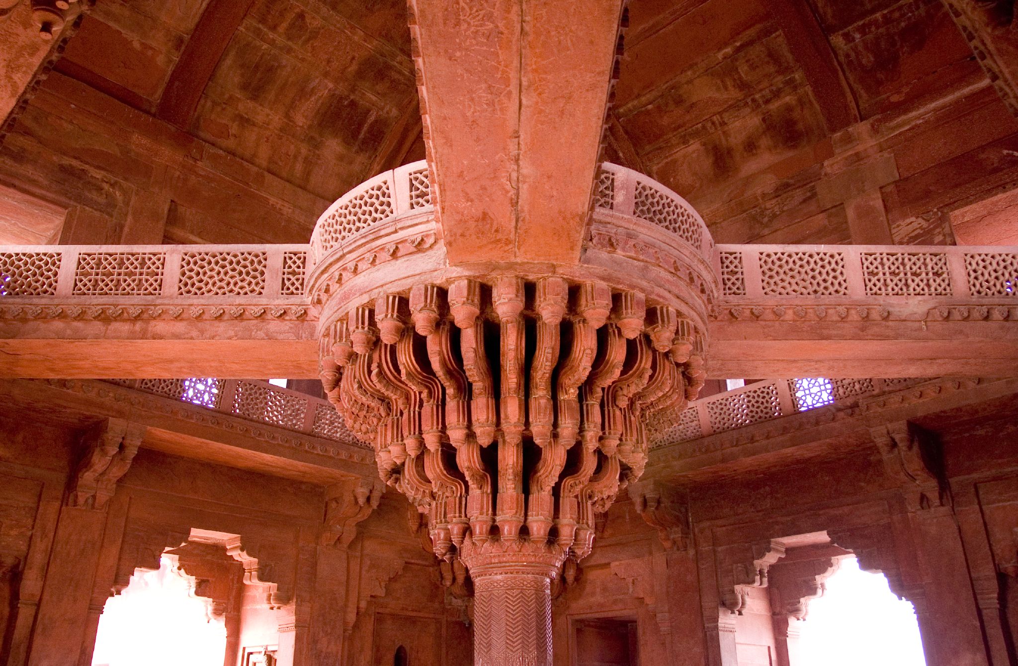 a very tall building with a ceiling made of bricks and intricate designs