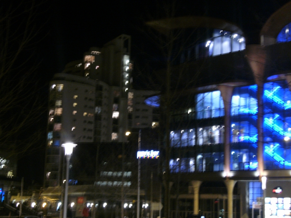 a large building at night with lots of windows and lights