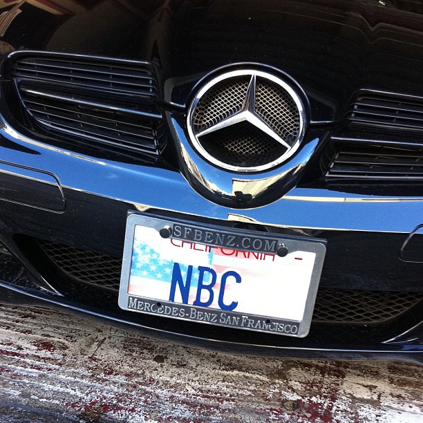 an american flag license plate on a mercedes benz