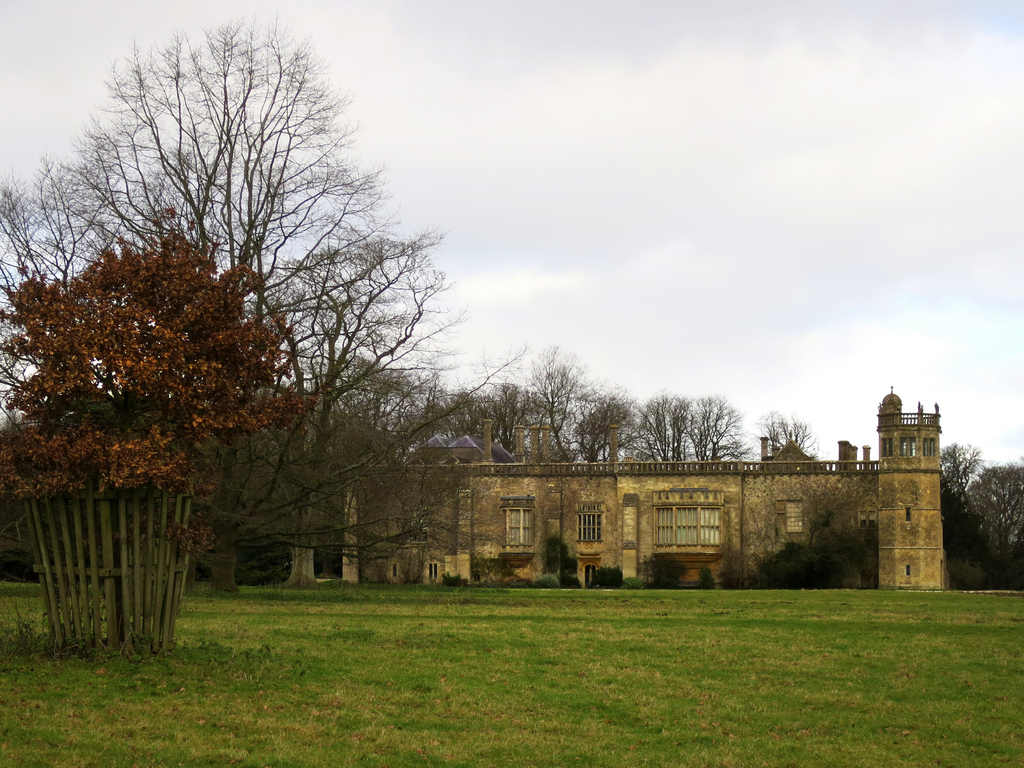 there is a large stone building next to trees