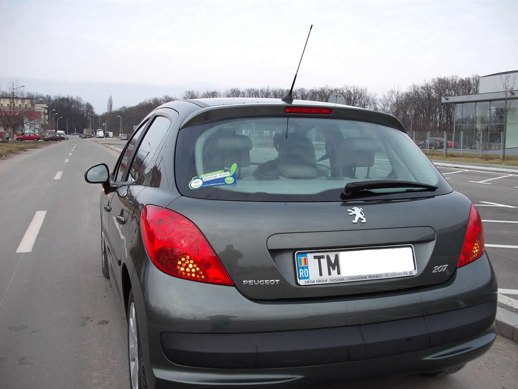 a car is parked at the side of the street