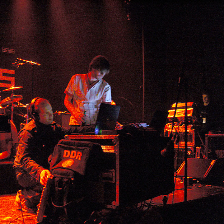 a group of people are looking at soing on a stage